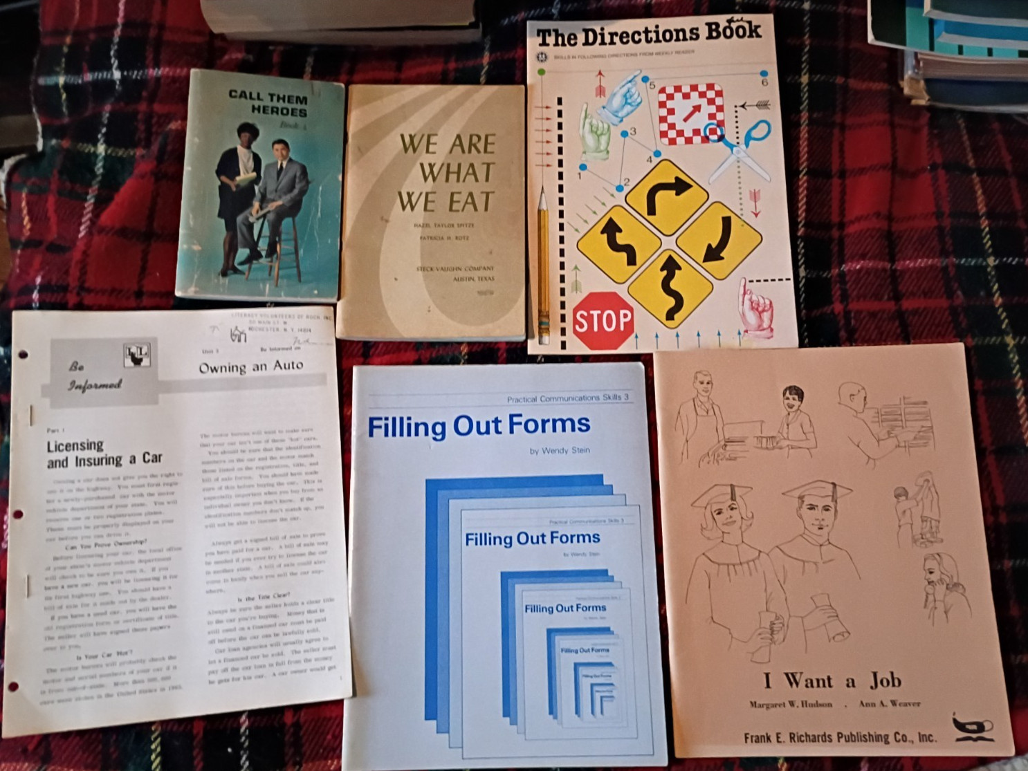 various vintage booklets: call them heroes, directions book, filling out forms,