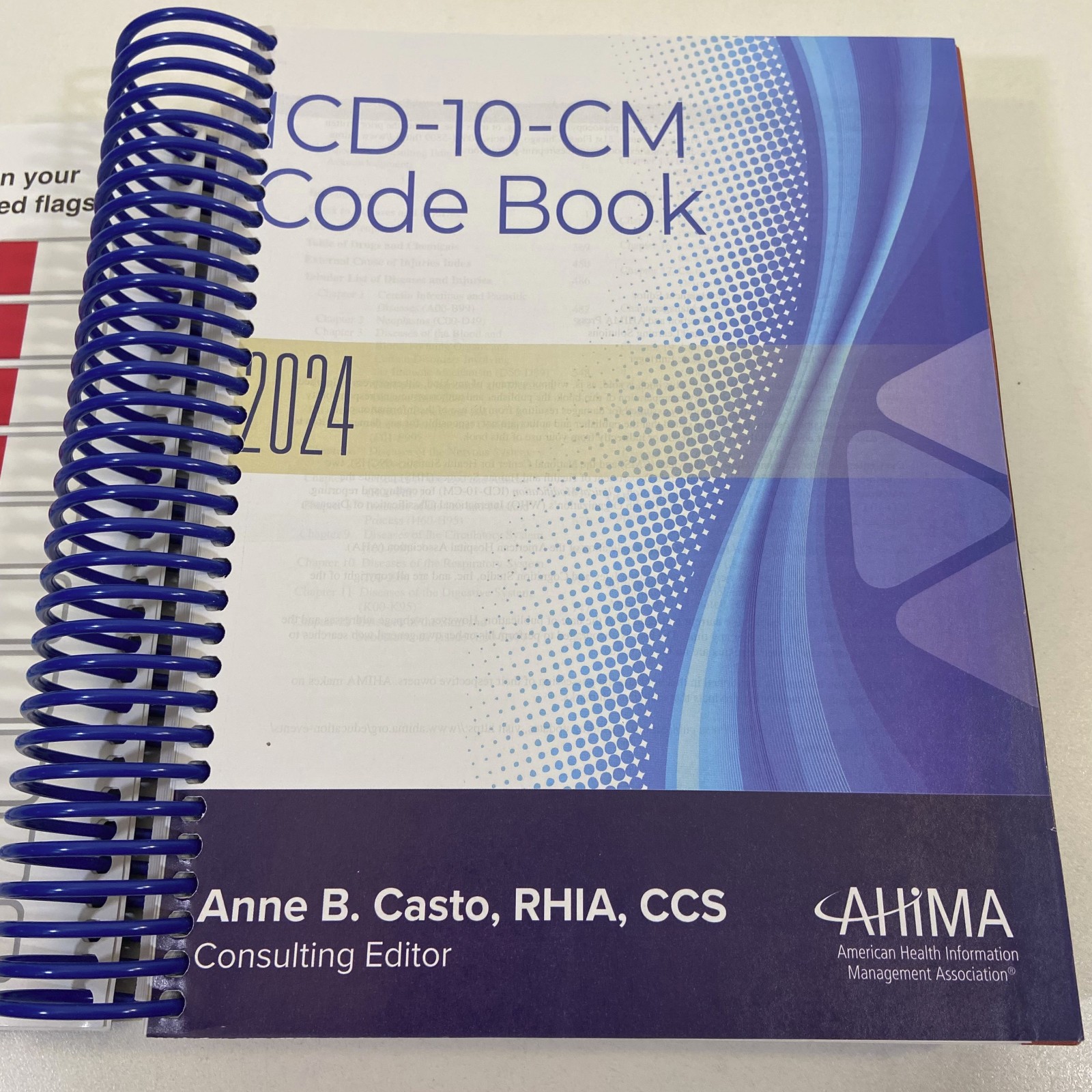 ICD-10-CM Code Book 2024 AHIMA Press Anne B Casto Spiralbound Unused Color Flags