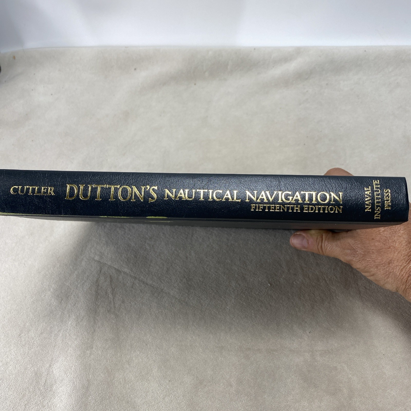 Dutton’s Nautical Navigation, 15th Edition by Thomas J Cutler 2004